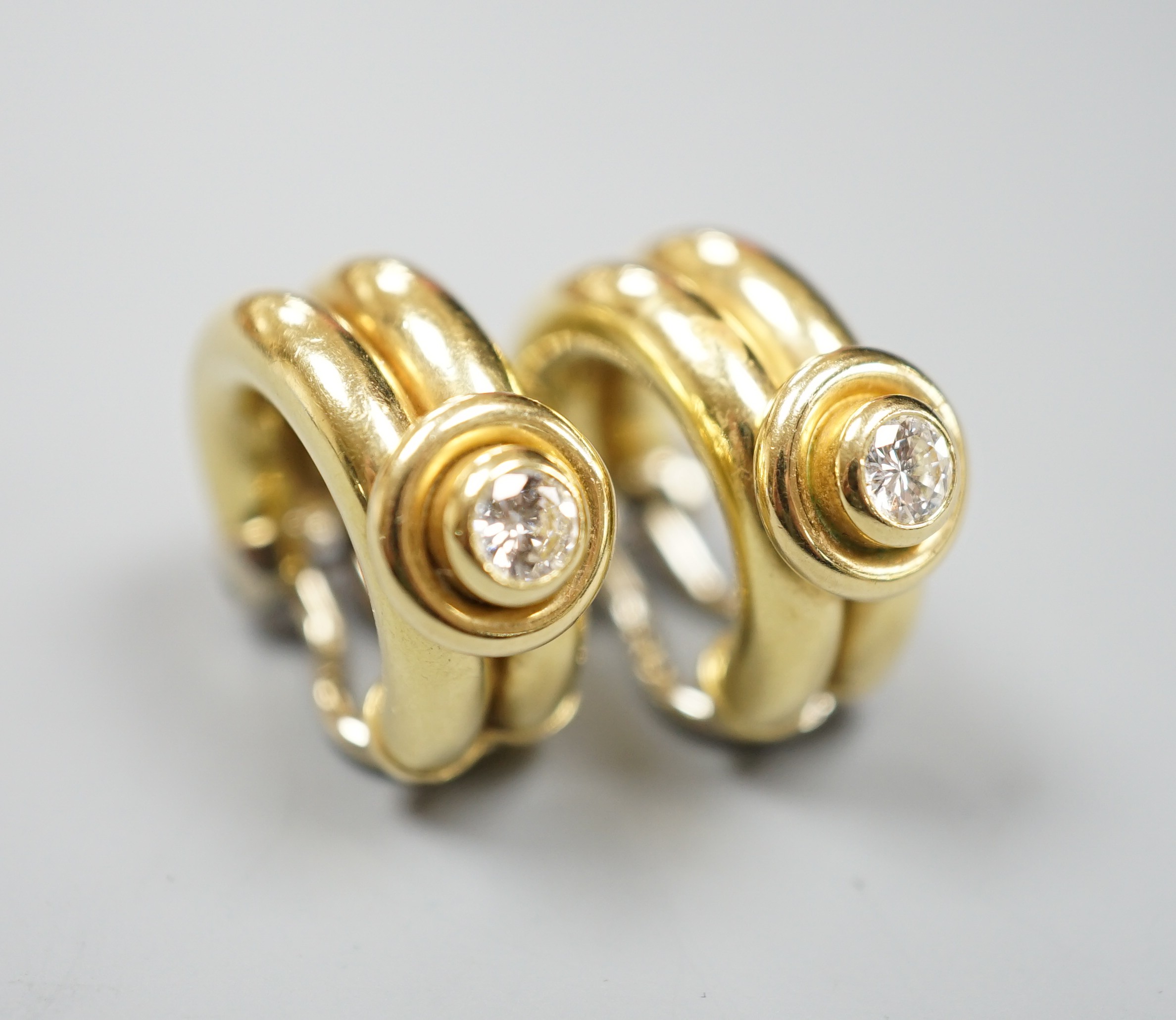 A pair of 20th century Italian 750 yellow metal and diamond set hoop ear clips, 22mm